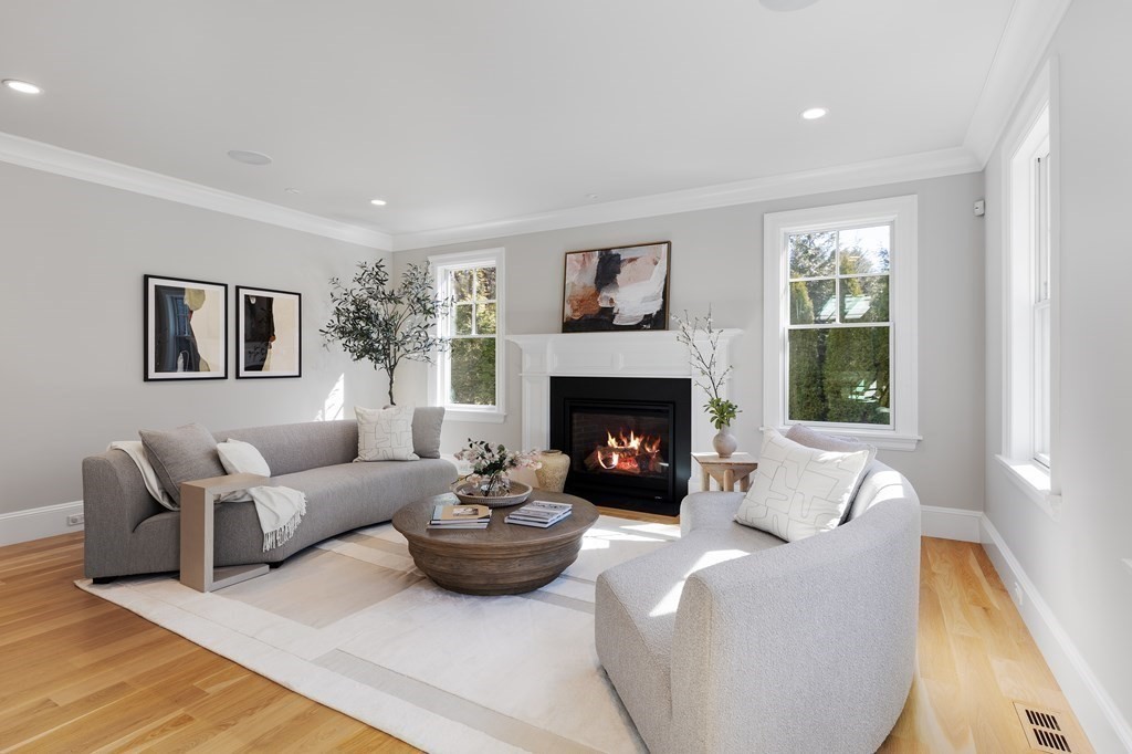 19 Longmeadow Road Wellesley, MA 02482 - Photo 12 of 34 a living room with furniture and a fireplace