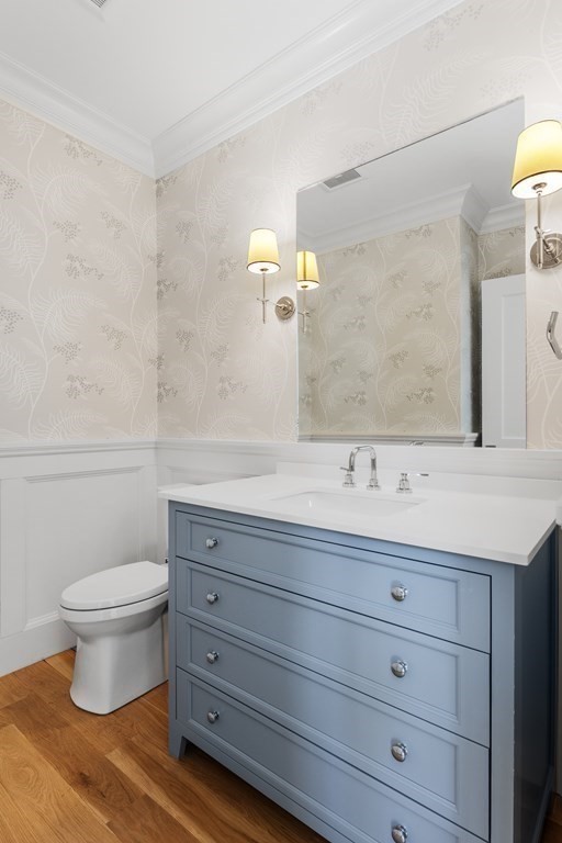 19 Longmeadow Road Wellesley, MA 02482 - Photo 13 of 34 a bathroom with a granite countertop toilet sink and mirror