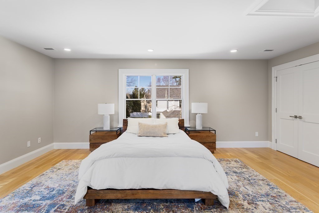 19 Longmeadow Road Wellesley, MA 02482 - Photo 19 of 34 a bedroom with a bed and a large window