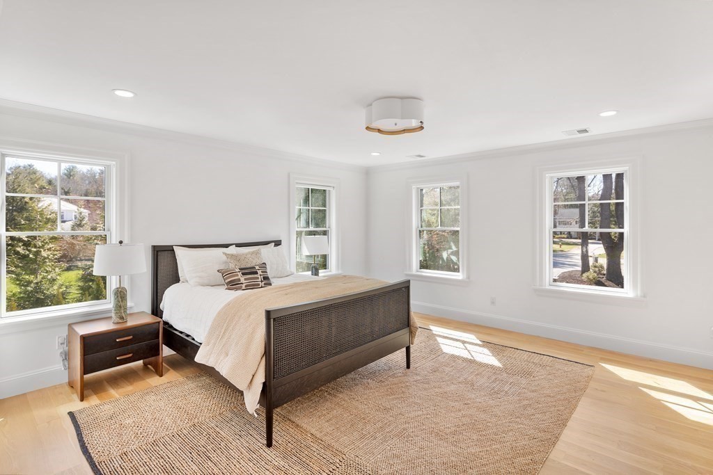 19 Longmeadow Road Wellesley, MA 02482 - Photo 23 of 34 a bedroom with a large bed and a window