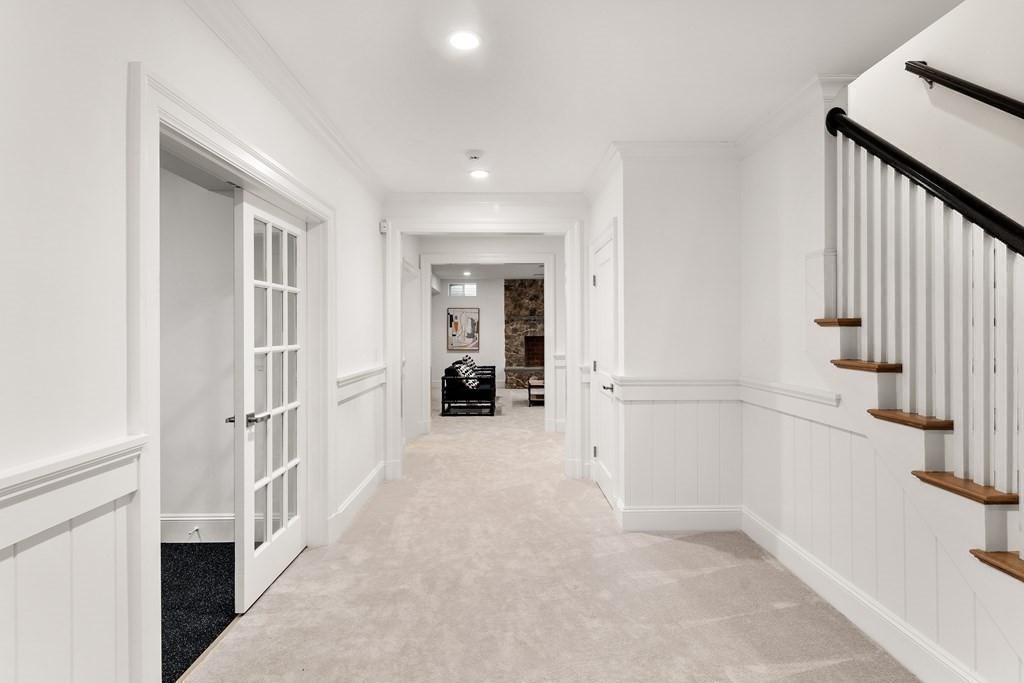 19 Longmeadow Road Wellesley, MA 02482 - Photo 31 of 34 a view of a hallway with a white walls and stairs