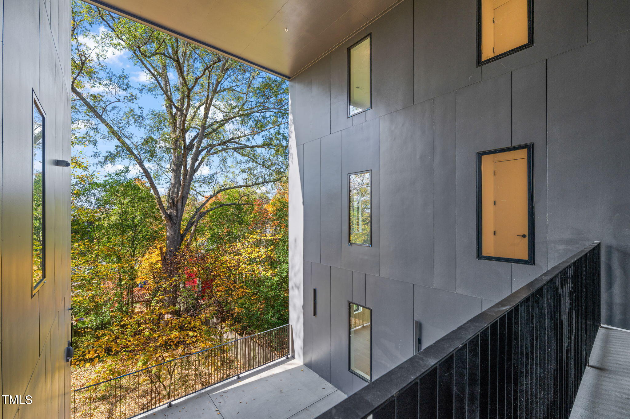 29 Enterprise Street, Unit 207 Raleigh, NC 27607 - Photo 18 of 36 a view of balcony with wooden floor and fence