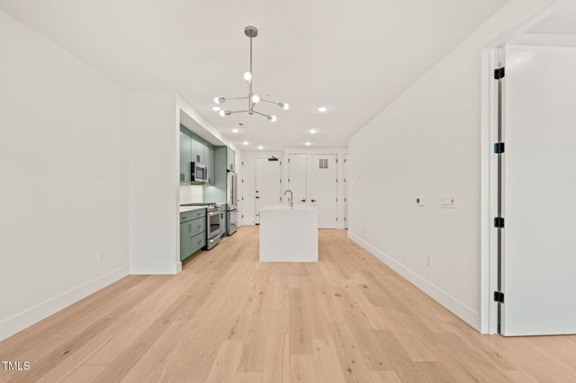 a view of a kitchen with wooden floor