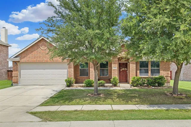 a kitchen with stainless steel appliances granite countertop a refrigerator and a stove