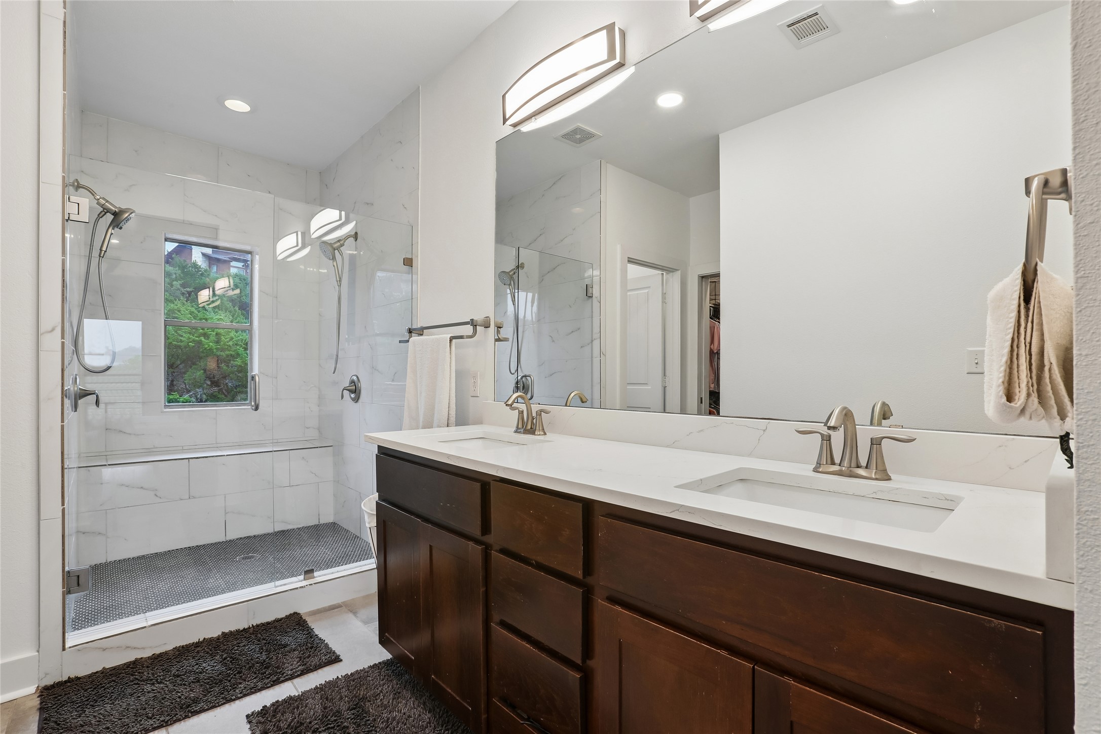8110 Ranch Road 2222, Unit 10 Austin, TX 78730 - Photo 11 of 23 a bathroom with a sink double vanity and a mirror