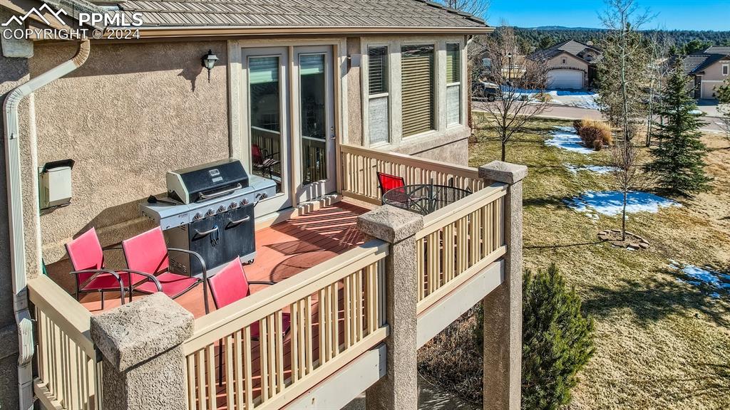 2644 Cinnabar Road Colorado Springs, CO 80921 - Photo 11 of 22 a balcony with table and chairs