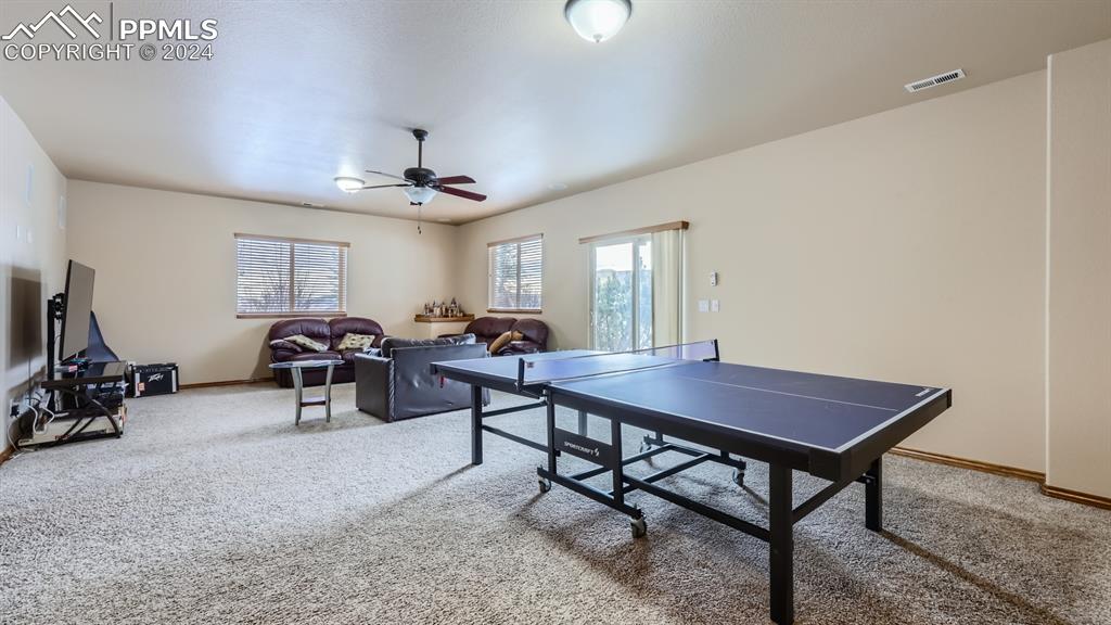 2644 Cinnabar Road Colorado Springs, CO 80921 - Photo 13 of 22 a view of a livingroom with furniture and a window