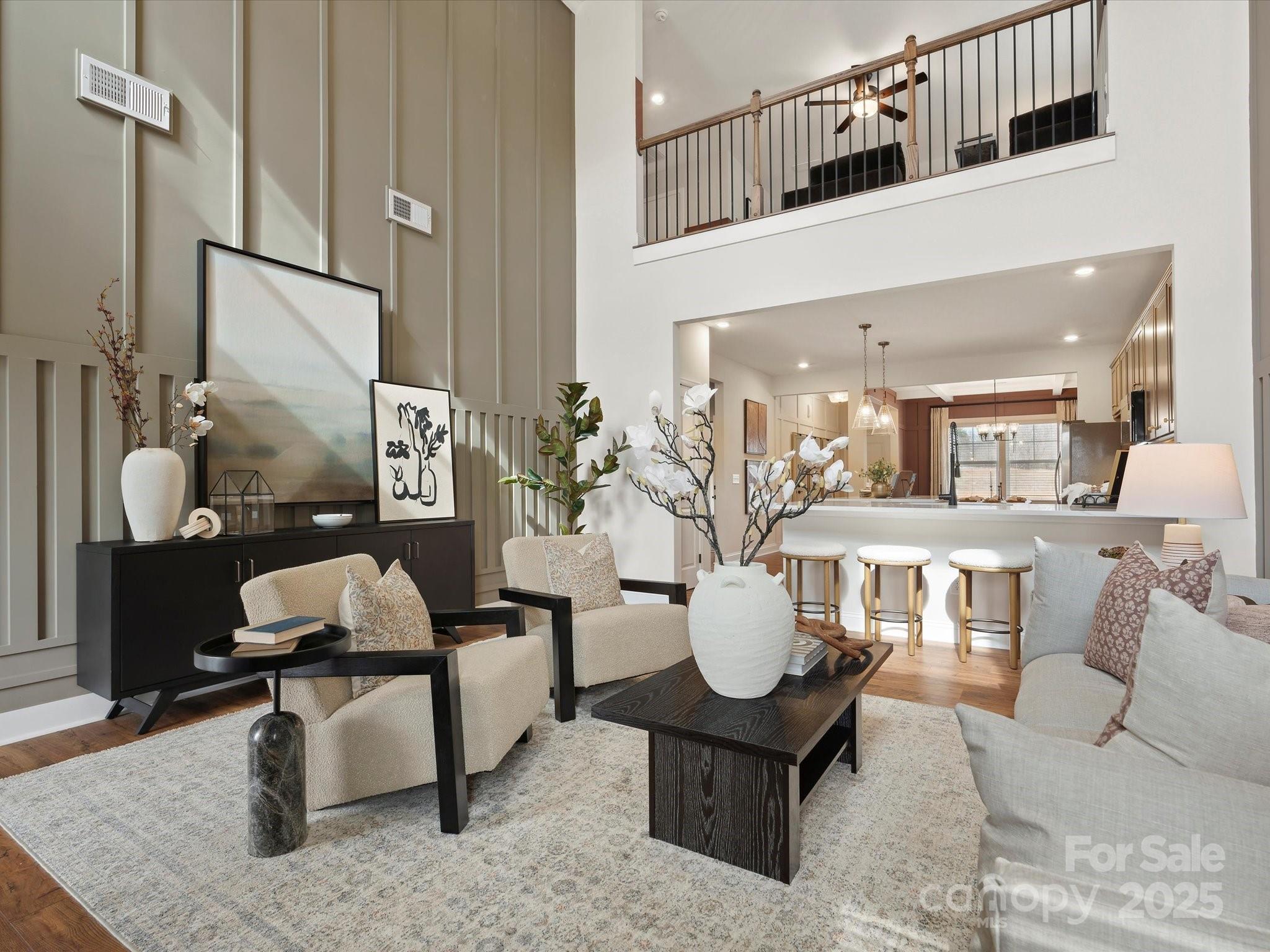 1018 Puddle Pond Road Indian Trail, NC 28079 - Photo 14 of 34 a living room with furniture and wooden floor