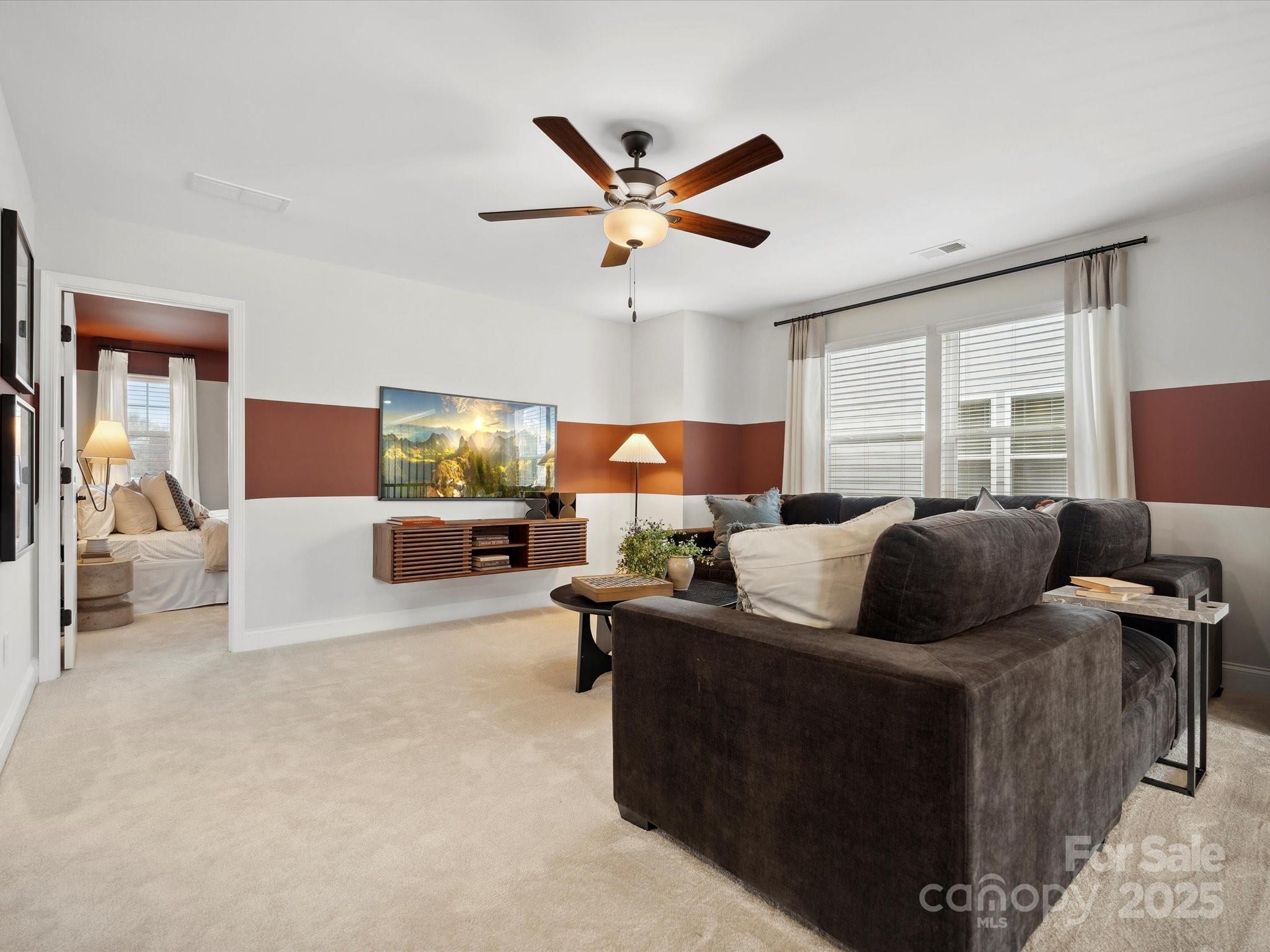 1018 Puddle Pond Road Indian Trail, NC 28079 - Photo 24 of 34 a living room with furniture and a large window