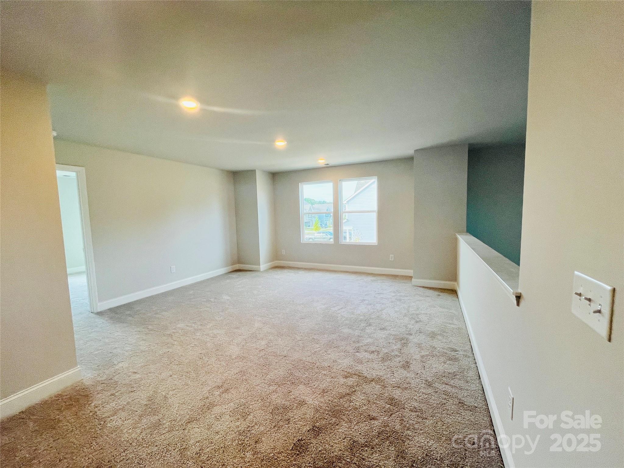1018 Puddle Pond Road Indian Trail, NC 28079 - Photo 8 of 34 an empty room with windows