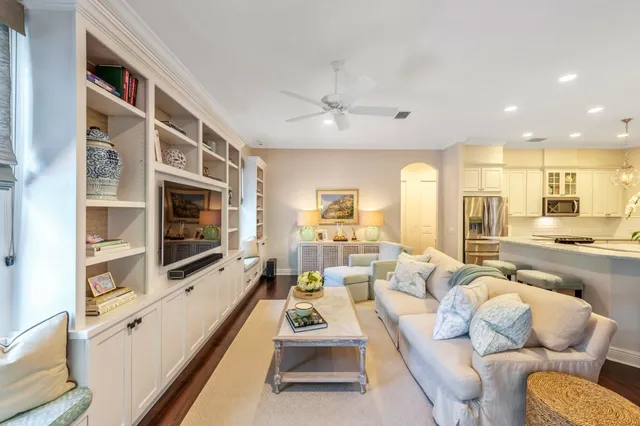 a living room with furniture fireplace and flat screen tv