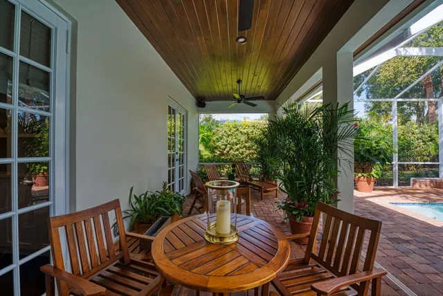 a view of a porch with furniture and yard