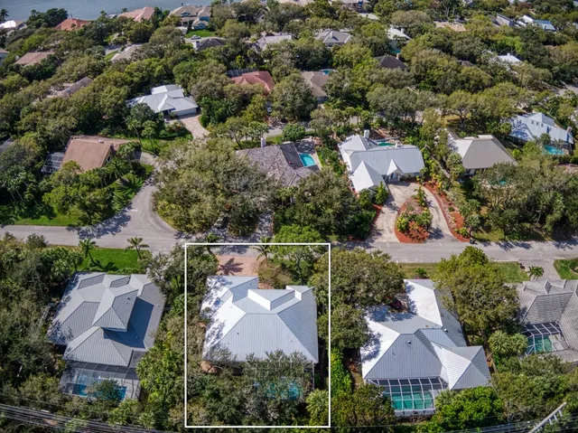 an aerial view of house with yard swimming pool and outdoor seating
