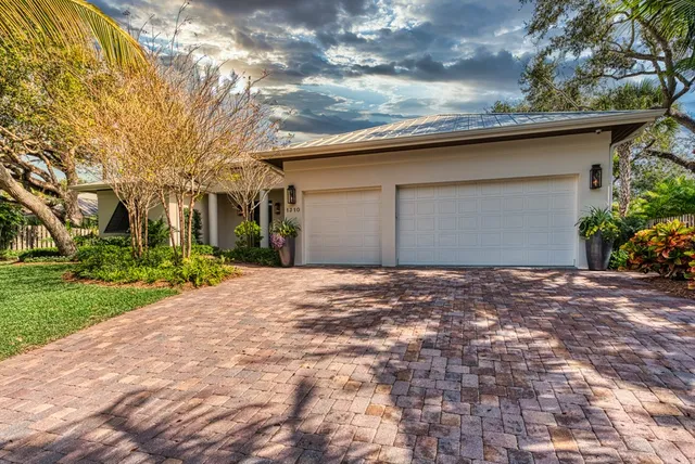 a backyard of a house with plants and trees