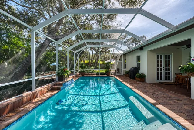 a view of swimming pool with a patio