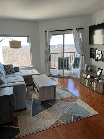 a living room with fireplace furniture and a flat screen tv
