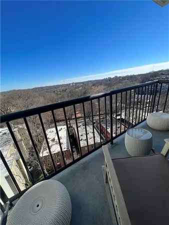 a balcony with outdoor seating
