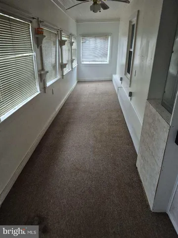 a view of hallway with windows