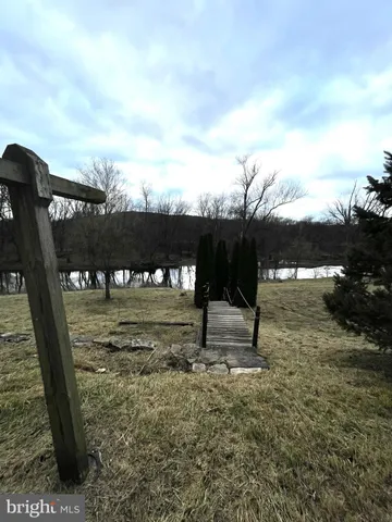 a view of a yard with an outdoor seating