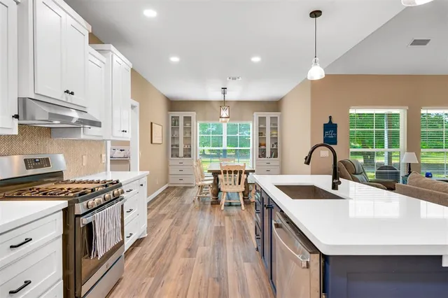 a view of a dining room with furniture window and outside view