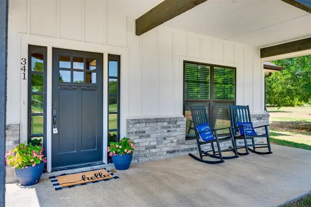 a living room with furniture fireplace and flat screen tv
