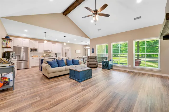 a kitchen with a sink a stove and cabinets