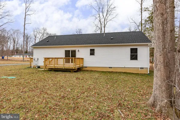 a house with trees in the background