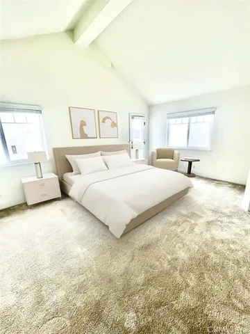 a bedroom with a bed and a couch