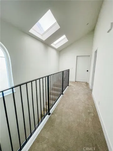 a kitchen with stainless steel appliances a stove a sink and cabinets