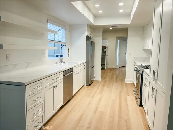 a spacious bathroom with a double vanity sink and mirror