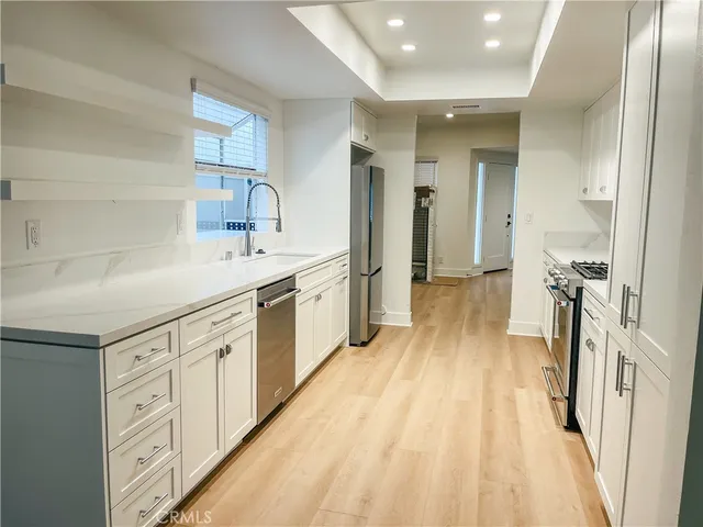 a spacious bathroom with a double vanity sink and mirror