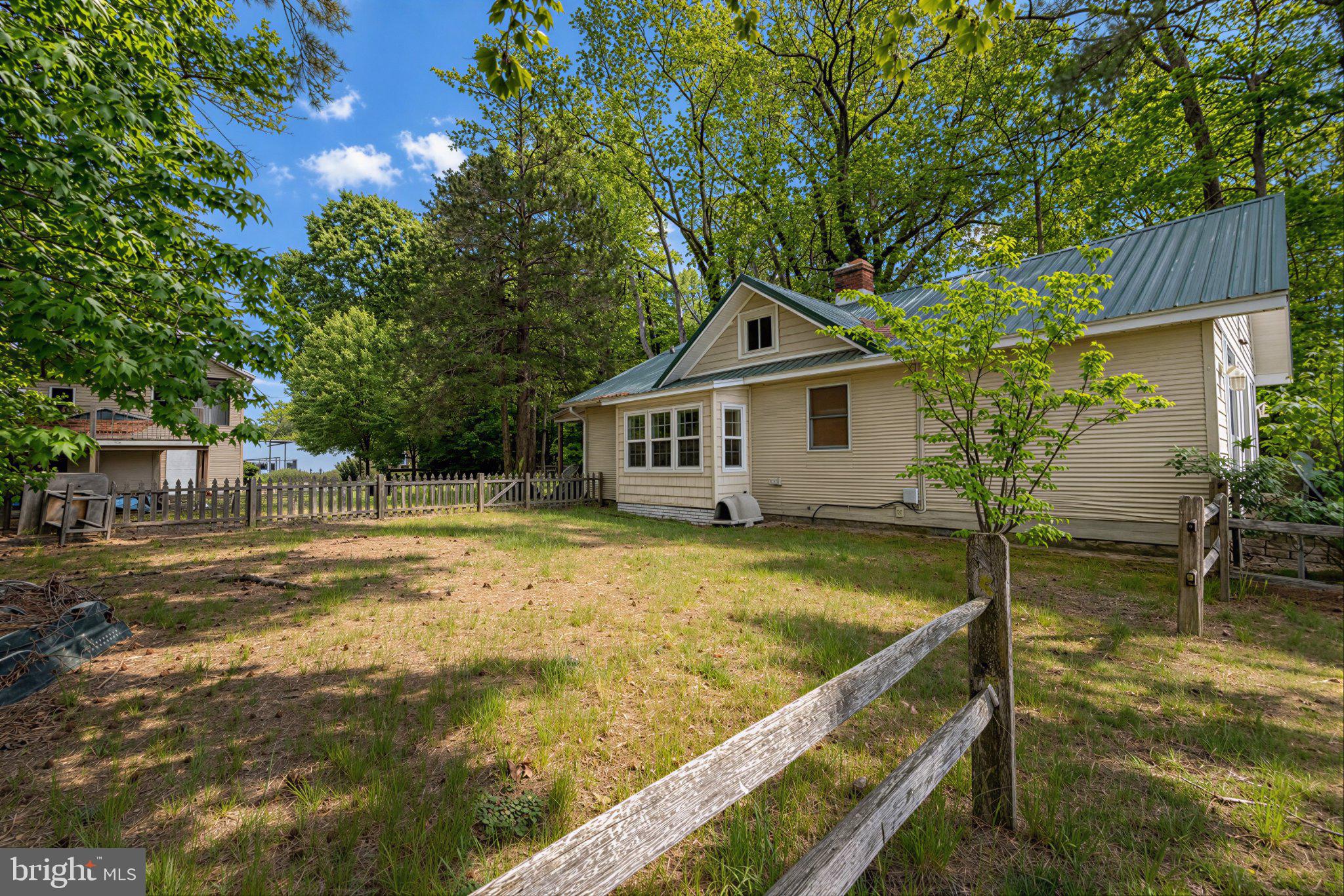 42195 White Point Beach Road Leonardtown, MD 20650 - Photo 20 of 57 Charming home amid lush greenery.