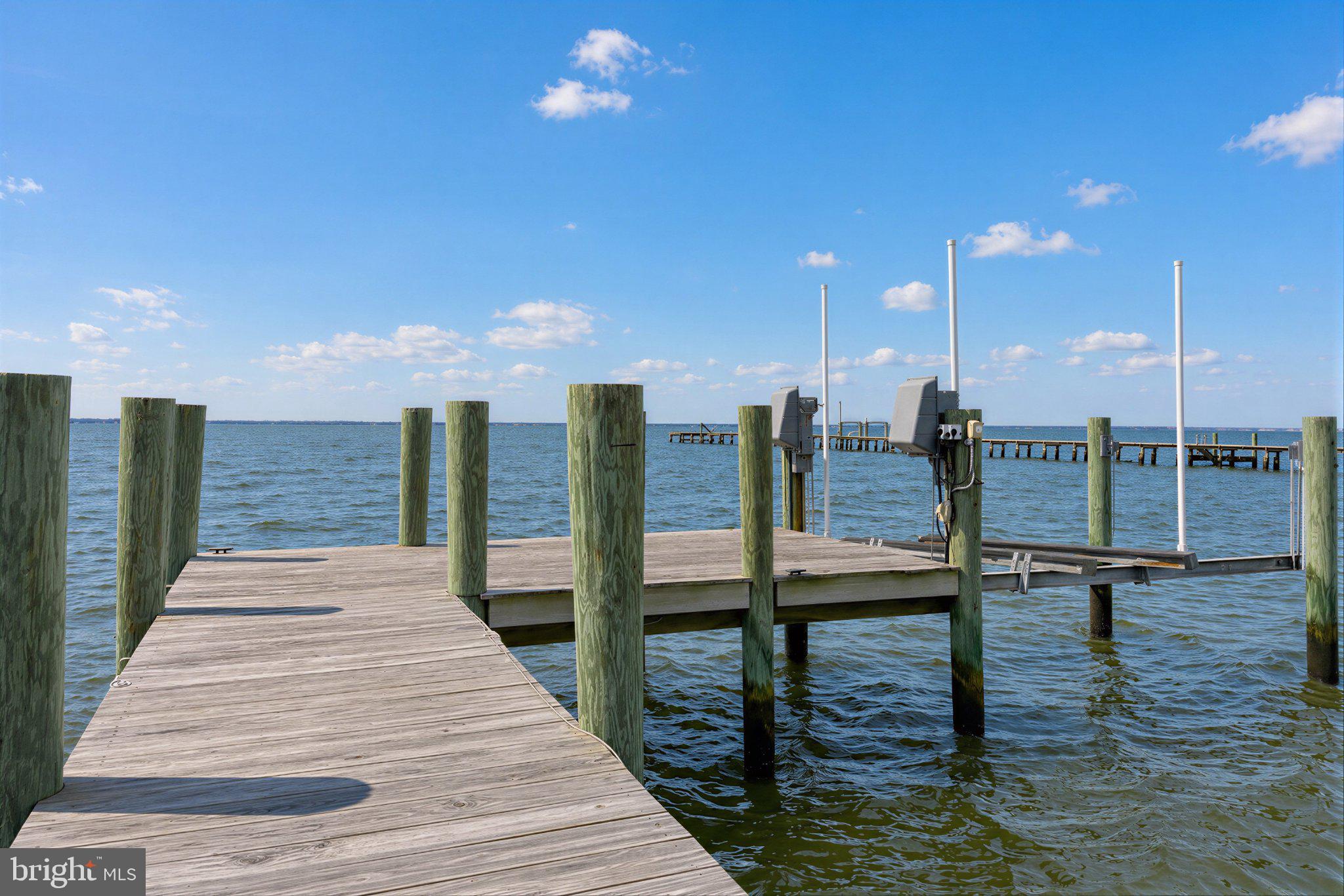 42195 White Point Beach Road Leonardtown, MD 20650 - Photo 25 of 57 Tranquil dock by the shimmering water.