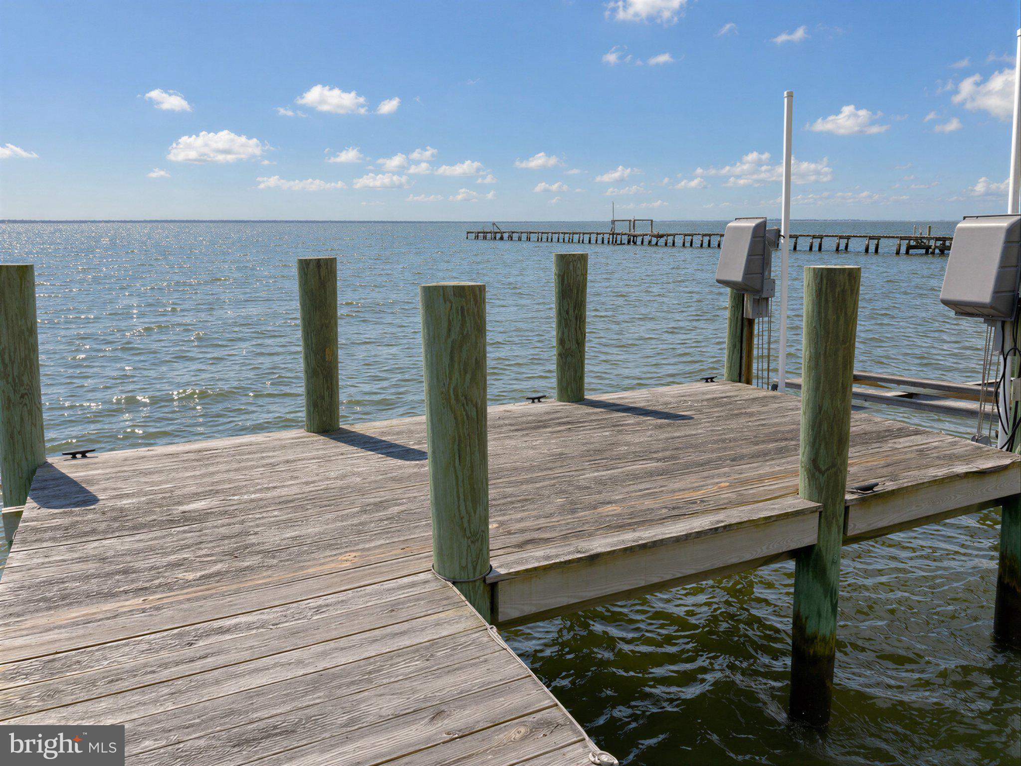 42195 White Point Beach Road Leonardtown, MD 20650 - Photo 26 of 57 Tranquil dock by the shimmering sea.