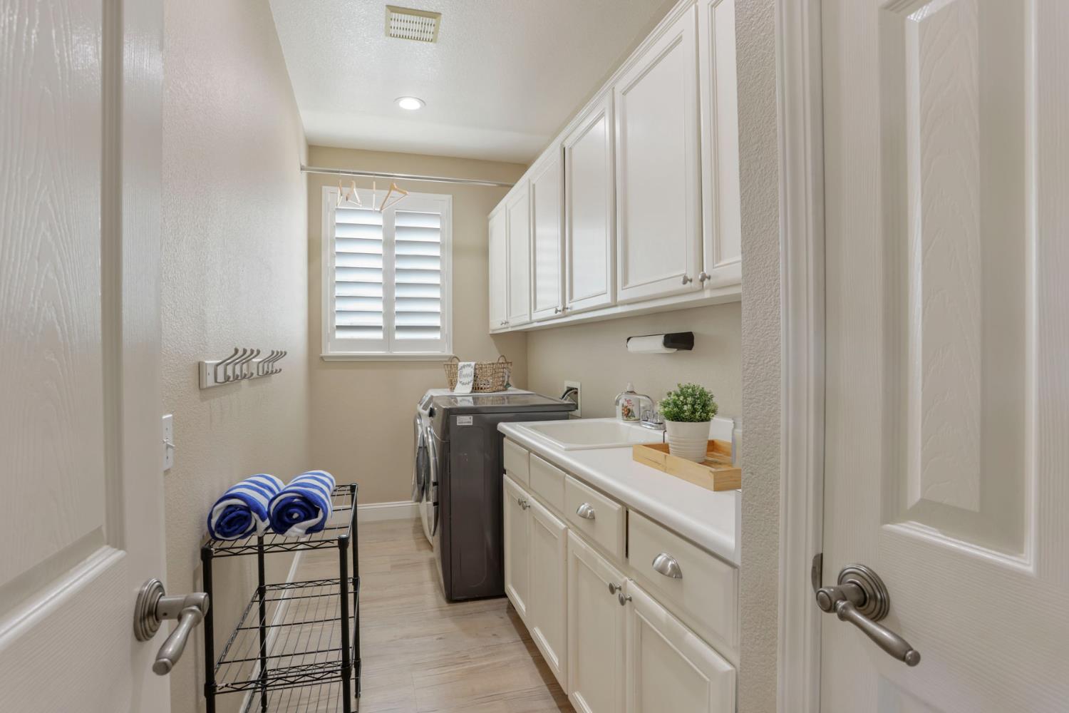 3755 Canyonlands Road Stockton, CA 95209 - Photo 13 of 37 a kitchen with a sink cabinets and window