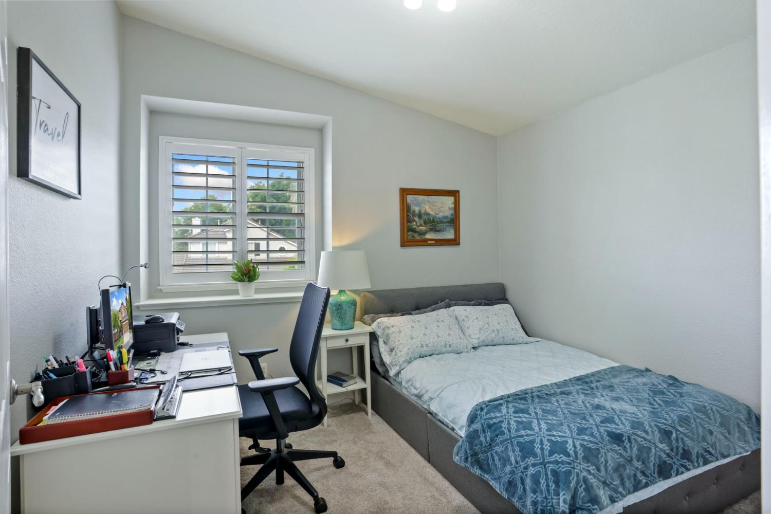 3755 Canyonlands Road Stockton, CA 95209 - Photo 15 of 37 a bedroom with a bed a desk and chair with window