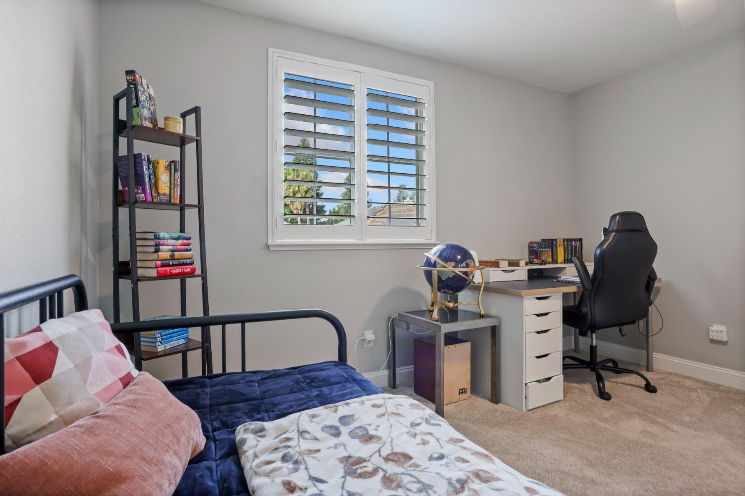 3755 Canyonlands Road Stockton, CA 95209 - Photo 18 of 37 a view of a workspace with furniture and a window
