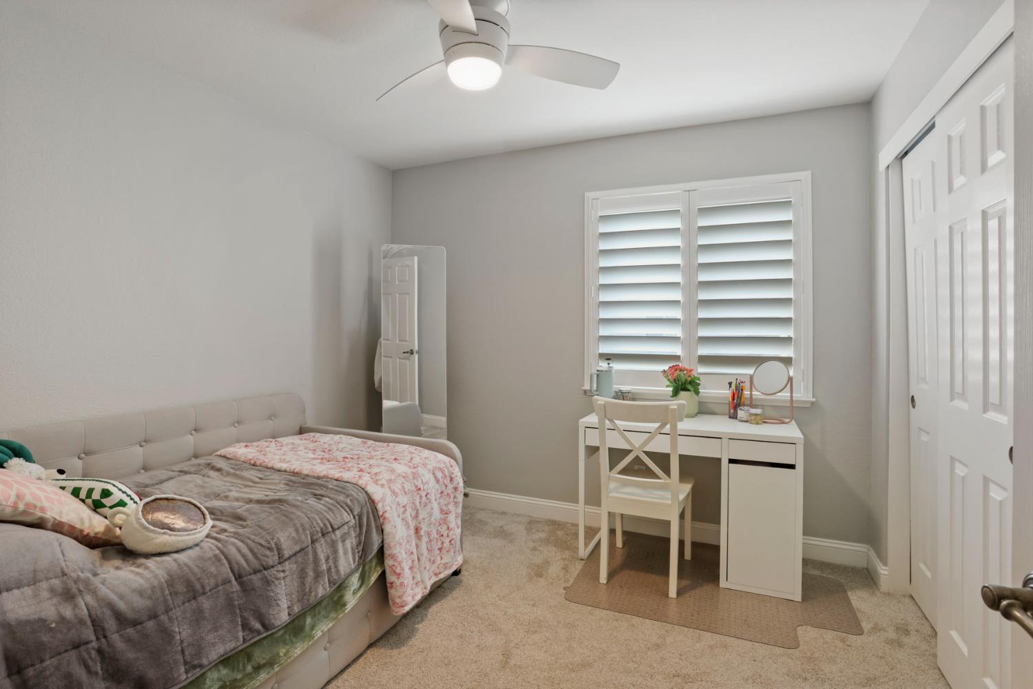 3755 Canyonlands Road Stockton, CA 95209 - Photo 19 of 37 a bedroom with a bed and a table in it