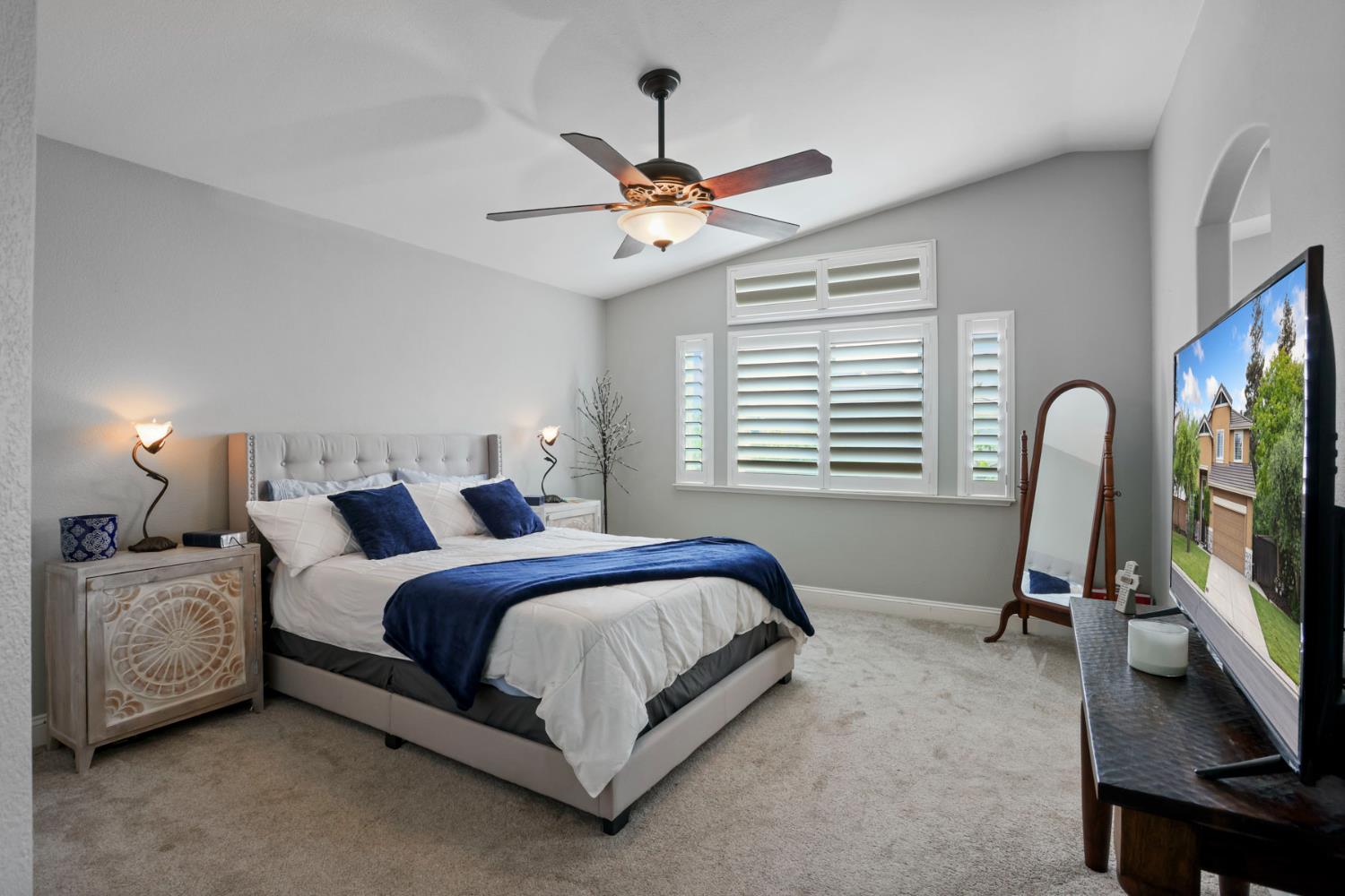 3755 Canyonlands Road Stockton, CA 95209 - Photo 20 of 37 a bedroom with bed tv and a window
