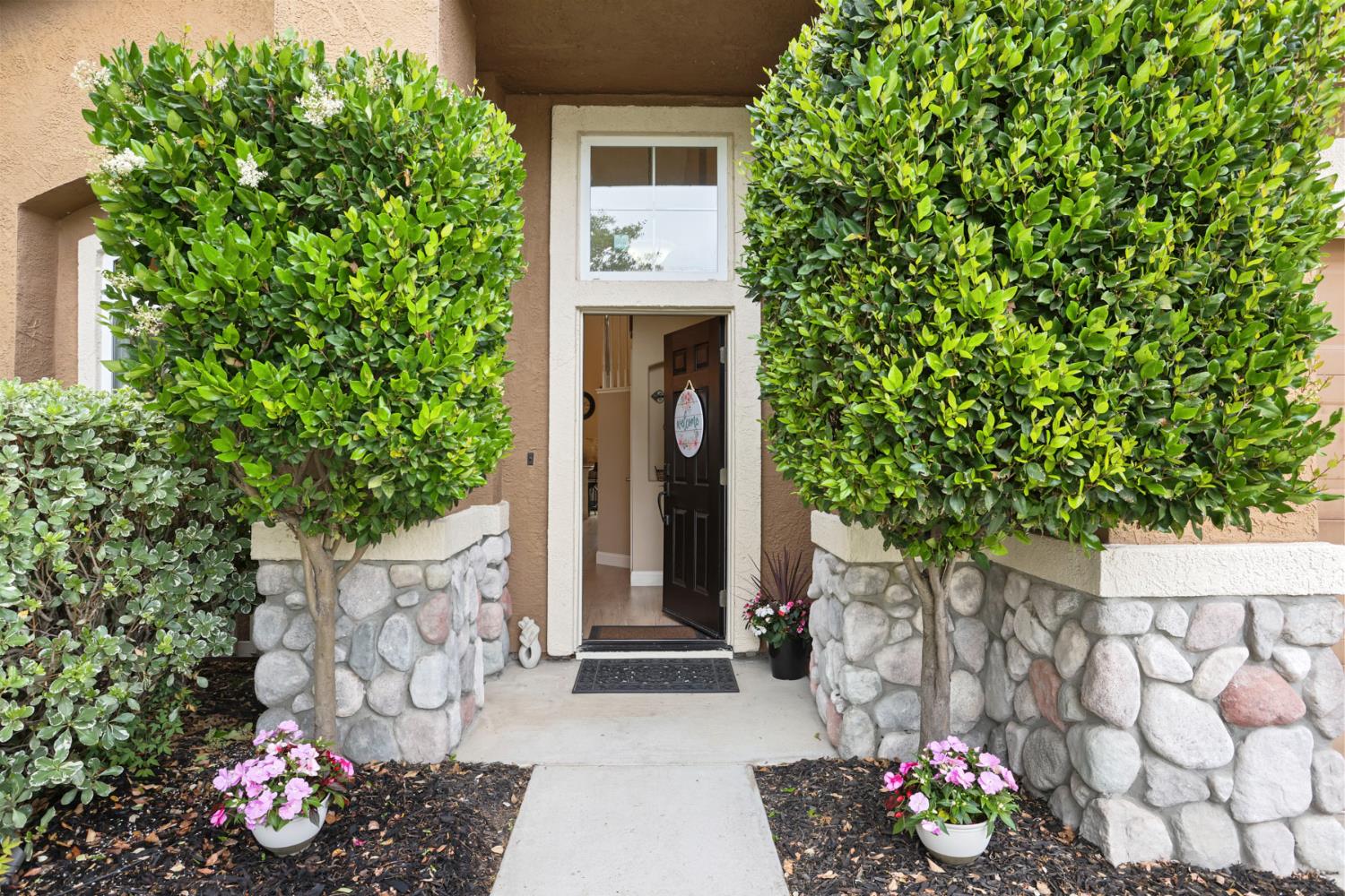 3755 Canyonlands Road Stockton, CA 95209 - Photo 2 of 37 a front view of a house with a garden