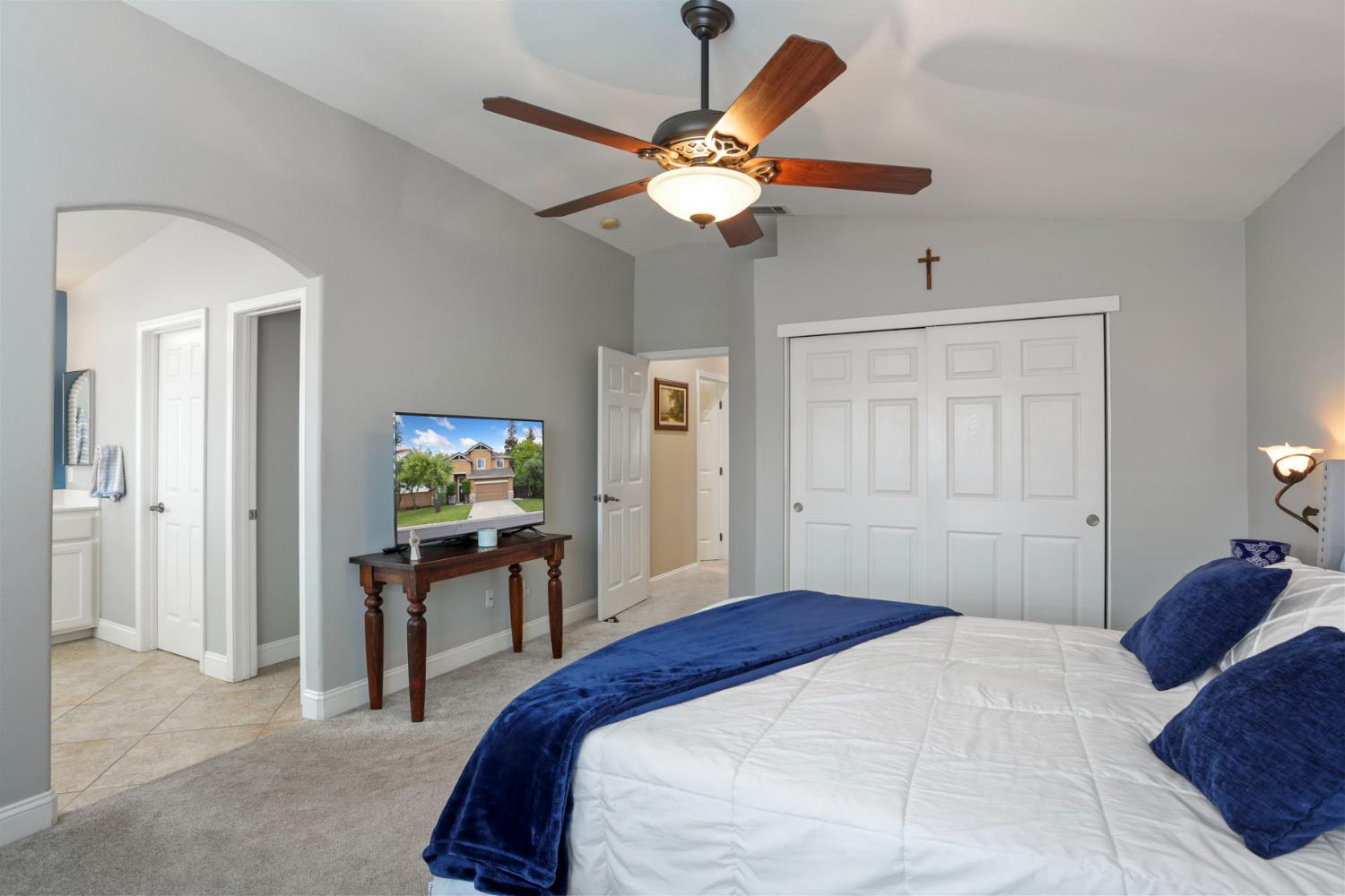 3755 Canyonlands Road Stockton, CA 95209 - Photo 22 of 37 a bedroom with a bed and a chandelier