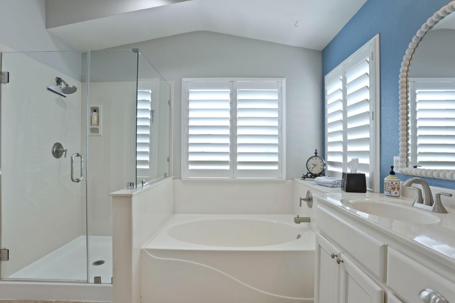 3755 Canyonlands Road Stockton, CA 95209 - Photo 25 of 37 a bathroom with a bathtub and a shower