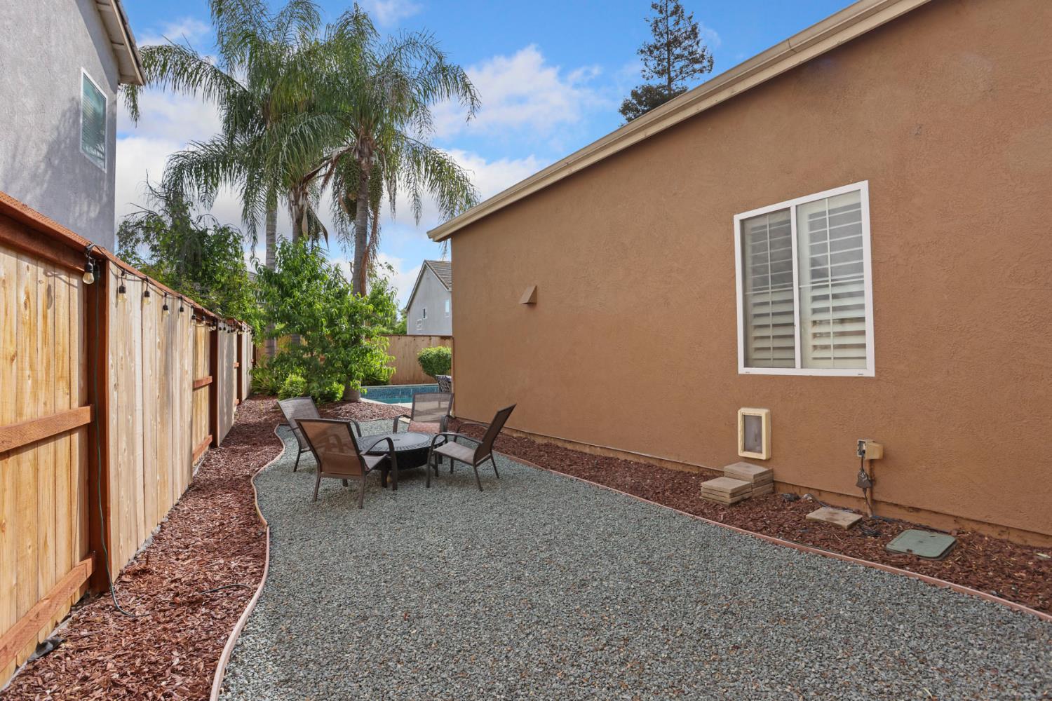 3755 Canyonlands Road Stockton, CA 95209 - Photo 27 of 37 a backyard of a house with outdoor seating
