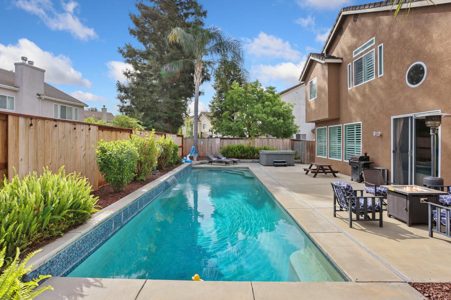 3755 Canyonlands Road Stockton, CA 95209 - Photo 30 of 37 a view of a swimming pool with a patio