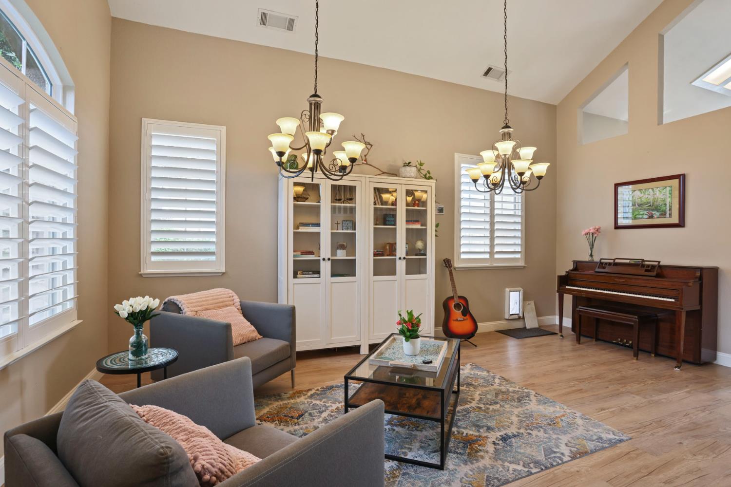 3755 Canyonlands Road Stockton, CA 95209 - Photo 5 of 37 a living room with furniture chandelier and a table