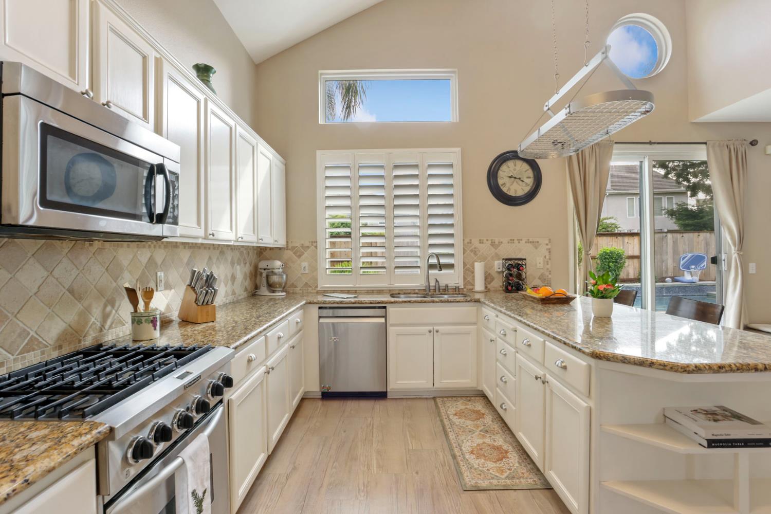 3755 Canyonlands Road Stockton, CA 95209 - Photo 8 of 37 a kitchen with stainless steel appliances granite countertop a stove and a sink