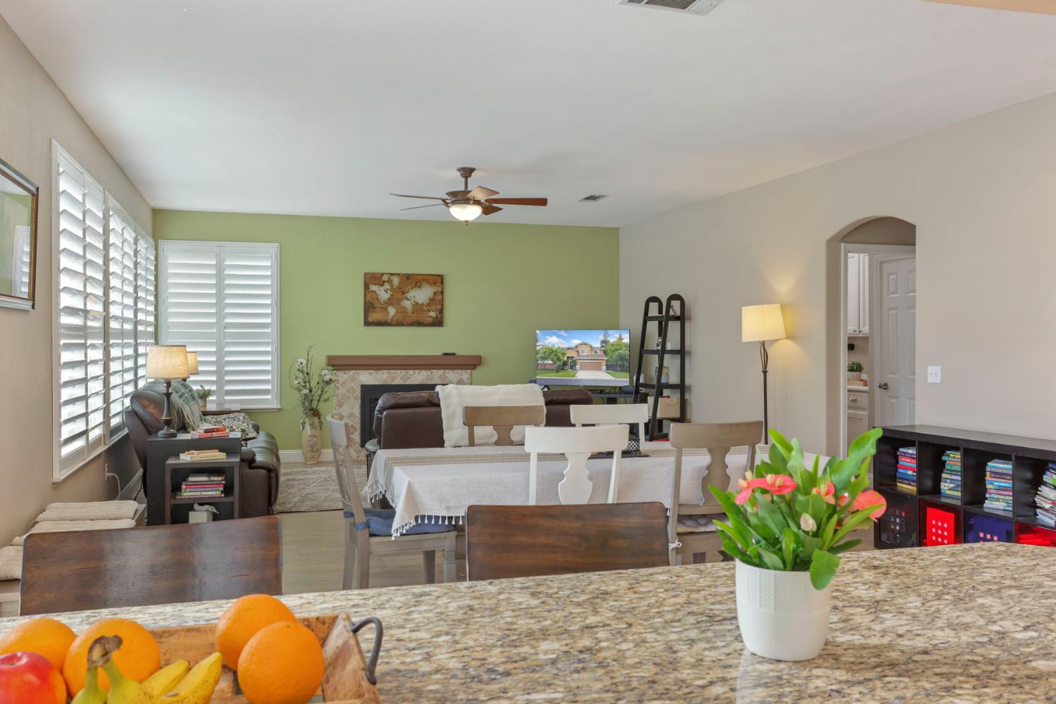3755 Canyonlands Road Stockton, CA 95209 - Photo 9 of 37 a living room with furniture fireplace and potted plants