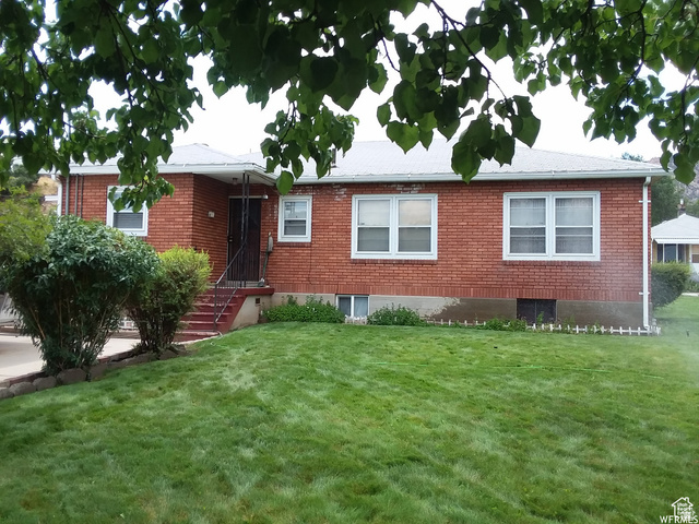 73 Garden Street Helper, UT 84526 - Photo 2 of 36 Single story home featuring a front yard and brick siding