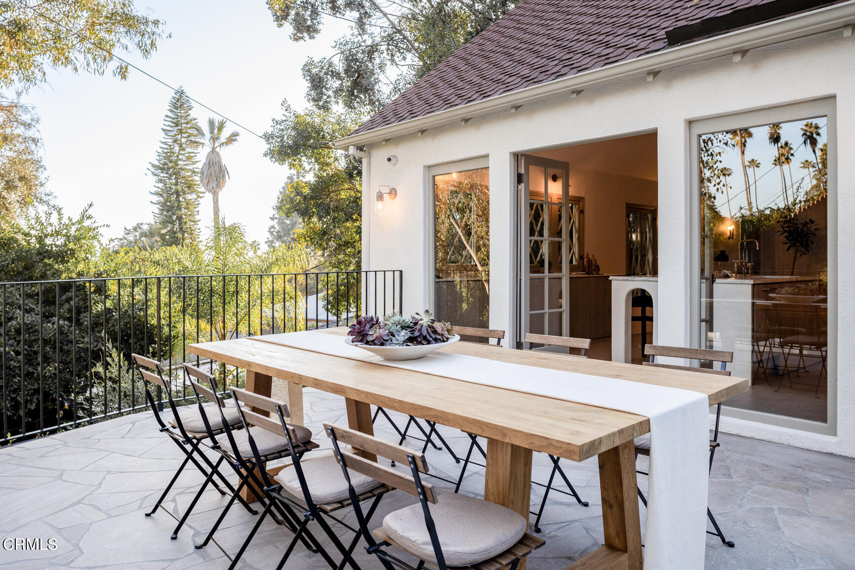 5314 Mt Royal Drive Eagle Rock, CA 90041 - Photo 39 of 47 a patio with a table and chairs and potted plants