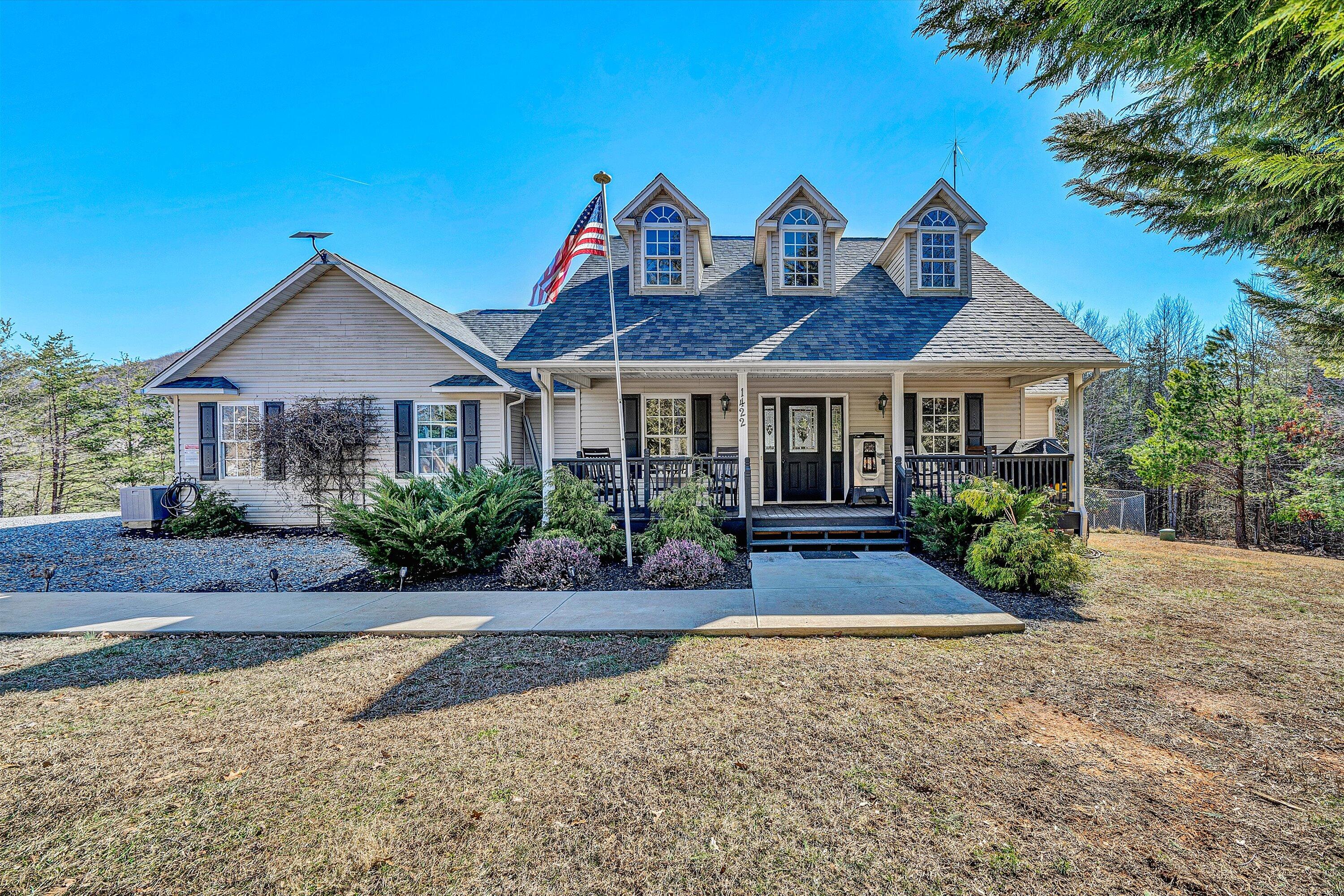1422 Isolane Road Callaway, VA 24067 - Photo 1 of 39 a front view of a house with a garden